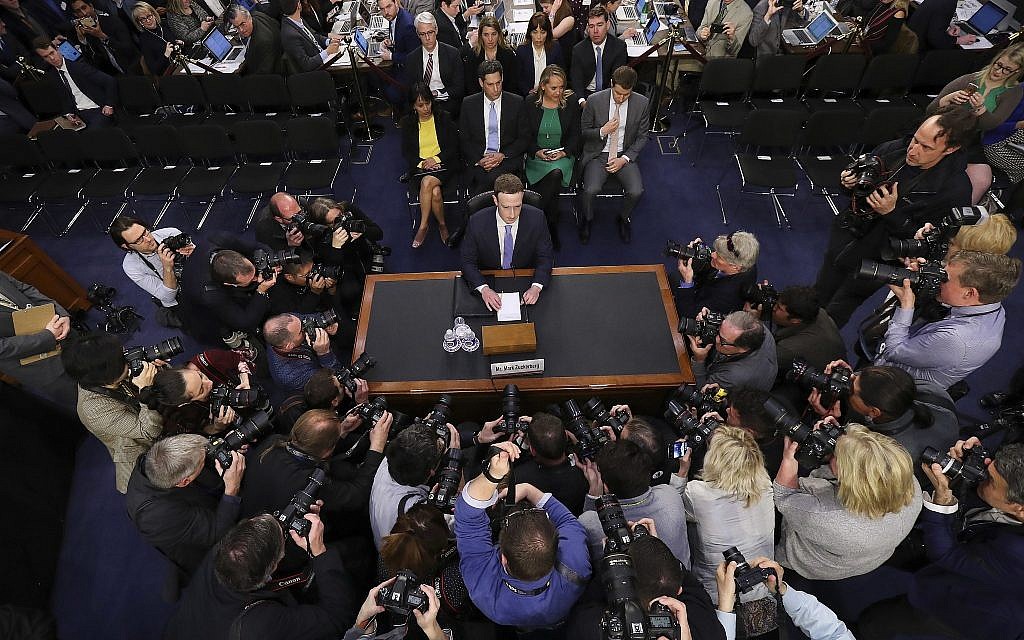 Facebook CEO Mark Zuckerberg arrives to testify before a joint hearing of the Commerce and Judiciary Committees on Capitol Hill, on April 10, 2018, about the use of Facebook data to target American voters in the 2016 election. (AP Photo/Pablo Martinez Monsivais)