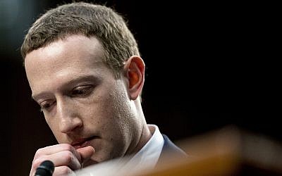 Facebook CEO Mark Zuckerberg pauses while testifying before a joint hearing of the Commerce and Judiciary Committees on Capitol Hill in Washington, April 10, 2018, about the use of Facebook data to target American voters in the 2016 election. (AP Photo/Andrew Harnik)