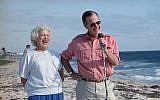 In this Nov. 14, 1988, file photo, President-elect George H.W. Bush and his wife, Barbara, are shown during a morning beachfront news conference in Gulf Stream, Fla. (AP Photo/Kathy Willens, File)