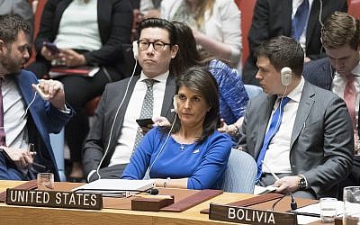 US Ambassador to the UN Nikki Haley listens as Syrian Ambassador to the UN Bashar Ja'afari speaks after a vote on a resolution during a Security Council meeting on the situation in Syria, on April 14, 2018, at United Nations headquarters. (AP Photo/Mary Altaffer)