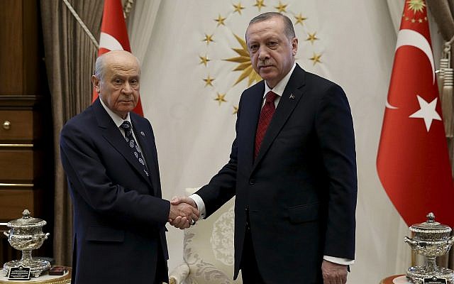 Turkey's President Recep Tayyip Erdogan, right, shakes hands with Devlet Bahceli, leader of the Nationalist Movement Party and his political ally, prior to their meeting, at the Presidential Palace, in Ankara, Turkey, Wednesday, April 18, 2018. (Pool Photo via AP) Turkey's President Recep Tayyip Erdogan, right, shakes hands with Devlet Bahceli, leader of the Nationalist Movement Party and his political ally, prior to their meeting, at the Presidential Palace, in Ankara, Turkey, Wednesday, April 18, 2018. (Pool Photo via AP)