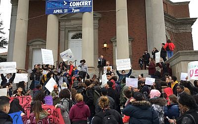 Syracuse University students gather outside Hendricks Chapel on Wednesday, April 18, 2018 to protest a video made by members of a now-suspended fraternity showing anti-Semitic, racist and sexist behavior in Syracuse, New York. (Lindsey Sabado/The Syracuse Newspapers via AP)