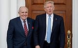 In this November 20, 2016, file photo, then-US President-elect Donald Trump, right, and former New York Mayor Rudy Giuliani pose for photographs as Giuliani arrives at the Trump National Golf Club Bedminster clubhouse in Bedminster, N.J. (AP Photo/Carolyn Kaster, File)