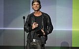 In this Nov. 24, 2013 file photo, Avicii accepts the award for favorite artist - electronic dance music at the American Music Awards in Los Angeles. Swedish-born Avicii, whose name is Tim Bergling, was found dead, Friday April 20, 2018, in Muscat, Oman. He was 28. (Photo by John Shearer/Invision/AP, File)