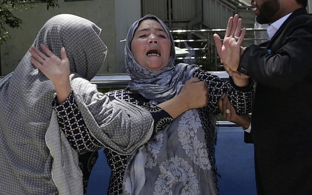 A woman cries at a hospital after she lost her son in a suicide attack on a voter registration center in Kabul, Afghanistan, Sunday, April 22, 2018. (AP Photo/Massoud Hossaini) A woman cries at a hospital after she lost her son in a suicide attack on a voter registration center in Kabul, Afghanistan, Sunday, April 22, 2018. (AP Photo/Massoud Hossaini)
