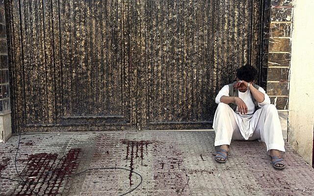 A relative of a victim cries outside a voter registration center which was attacked by a suicide bomber in Kabul, Afghanistan, Sunday, April 22, 2018. (AP Photo/ Rahmat Gul) A relative of a victim cries outside a voter registration center which was attacked by a suicide bomber in Kabul, Afghanistan, Sunday, April 22, 2018. (AP Photo/ Rahmat Gul)