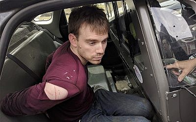 In this photo released by the Metro Nashville Police Department, Travis Reinking sits in a police car after being arrested in Nashville, Tenn., on April 23, 2018. (Metro Nashville Police Department via AP)