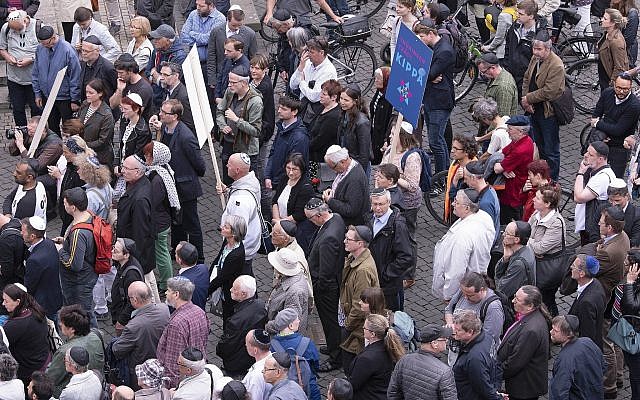 People of different faiths wear the Jewish kippa during a demonstration against antisemitism in Germany in Erfurt, Germany, April 25, 2018. (AP Photo/Jens Meyer)