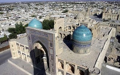 A general view of Bukhara, Uzbekistan, taken from the legendary Kalyan minaret with the Mir-I-Arab Madrassa in the foreground, November 21, 2001 (AP Photo/Mindaugas Kulbis)