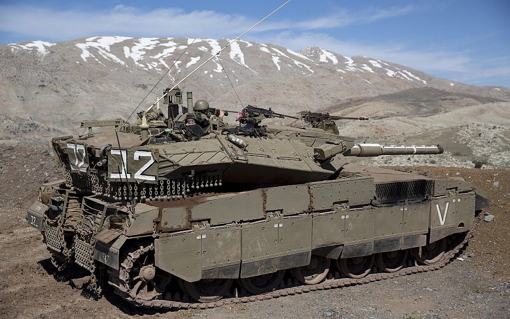 File: Israeli soldiers peer into Syria from their tank on the Golan Heights on February 18, 2016. (Ariel Schalit/AP Photo) File: Israeli soldiers peer into Syria from their tank on the Golan Heights on February 18, 2016. (Ariel Schalit/AP Photo)