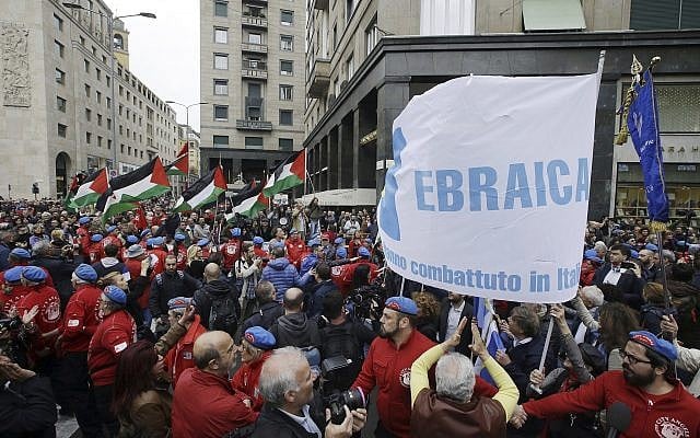 People hold up a flag of the Jewish Brigade as Palestinian flags wave in background during a demonstration to mark Italy's Liberation day, in Milan, Italy, April 25, 2017. (AP Photo/Luca Bruno) People hold up a flag of the Jewish Brigade as Palestinian flags wave in background during a demonstration to mark Italy's Liberation day, in Milan, Italy, April 25, 2017. (AP Photo/Luca Bruno)