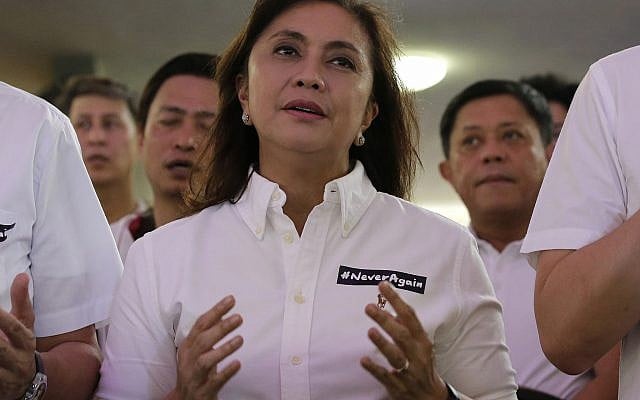Philippine Vice President Leni Robredo attends a mass wearing a sticker "Never Again" at the University of the Philippines Church of the Holy Sacrifice to commemorate the 45th anniversary of the imposition of martial law by the late Philippine dictator Ferdinand Marcos in metropolitan Manila, Philippines, September 21, 2017. (AP Photo/Aaron Favila) Philippine Vice President Leni Robredo attends a mass wearing a sticker "Never Again" at the University of the Philippines Church of the Holy Sacrifice to commemorate the 45th anniversary of the imposition of martial law by the late Philippine dictator Ferdinand Marcos in metropolitan Manila, Philippines, September 21, 2017. (AP Photo/Aaron Favila)