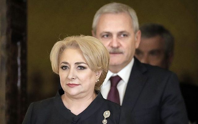 Romanian Prime Minister Viorica Dancila, left, arrives, followed by the leader of the ruling Social Democratic party Liviu Dragnea for the swearing in ceremony of her cabinet, in Bucharest, Romania, Monday, January 29, 2018. (AP Photo/Vadim Ghirda) Romanian Prime Minister Viorica Dancila, left, arrives, followed by the leader of the ruling Social Democratic party Liviu Dragnea for the swearing in ceremony of her cabinet, in Bucharest, Romania, Monday, January 29, 2018. (AP Photo/Vadim Ghirda)