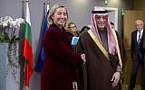 European Union foreign policy chief Federica Mogherini, left, greets Saudi Arabia's Foreign Minister Adel al-Jubeir after a meeting of EU foreign ministers at the Europa building in Brussels on Monday, Feb. 26, 2018. European Union foreign ministers met in Brussels on Monday to debate ways to revive Middle East peace efforts and discuss the crisis in Venezuela. (AP Photo/Virginia Mayo)