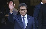 President of Honduras Juan Orlando Hernandez waves during a visit to Santiago, Chile, March 10, 2018. (Esteban Felix/AP)