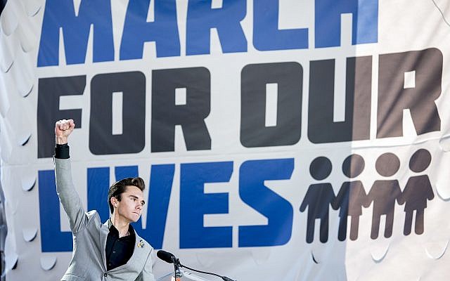 David Hogg, a survivor of the mass shooting at Marjory Stoneman Douglas High School in Parkland, Florida., raises his fist after speaking during the 'March for Our Lives' rally in support of gun control in Washington, Saturday, March 24, 2018 (AP Photo/Andrew Harnik) David Hogg, a survivor of the mass shooting at Marjory Stoneman Douglas High School in Parkland, Florida., raises his fist after speaking during the 'March for Our Lives' rally in support of gun control in Washington, Saturday, March 24, 2018 (AP Photo/Andrew Harnik)