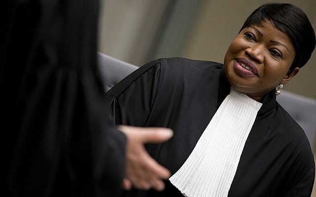Public Prosecutor Fatou Bensouda, right, waits for alleged jihadist leader Al Hassan Ag Abdoul Aziz Ag Mohamed Ag Mahmoud to enter the court room for his initial appearance on charges of war crimes and crimes against humanity at the International Criminal Court in The Hague, Netherlands, Wednesday, April 4, 2018. After his capture in Mali, the court in The Hague said that Al Hassan allegedly committed the crimes in Timbuktu while the town was under the control of extremists between April 2012 and January 2013. (AP Photo/Peter Dejong, Pool) Public Prosecutor Fatou Bensouda, right, waits for alleged jihadist leader Al Hassan Ag Abdoul Aziz Ag Mohamed Ag Mahmoud to enter the court room for his initial appearance on charges of war crimes and crimes against humanity at the International Criminal Court in The Hague, Netherlands, Wednesday, April 4, 2018. After his capture in Mali, the court in The Hague said that Al Hassan allegedly committed the crimes in Timbuktu while the town was under the control of extremists between April 2012 and January 2013. (AP Photo/Peter Dejong, Pool)