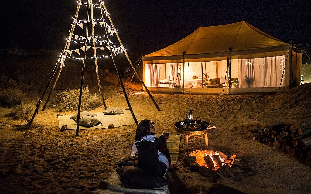 Israel's Tourism Ministry's temporary glamping tent guest with the their winner, Charline Wolff from Germany, indulging in a spot of stargazing (Courtesy Daniel Bear)