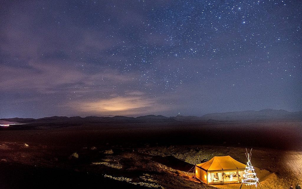 An aerial view of the stars and Tourism Ministry glamping tent set up temporarily in the Ramon Crater as part of an international marketing campaign. (Courtesy, Daniel Bear)