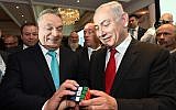 Prime Minister Benjamin Netanyahu and Hungarian Prime Minister Viktor Orban (L) hold a Rubik's Cube at the Hungary-Israel Business Forum in Budapest, Hungary, on July 19, 2017. (Haim Zach/ GPO/ Flash90)