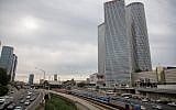 Train tracks and the Ayalon highway in central Tel Aviv, with the Azrieli Towers as a backdrop, December 18, 2017. (Miriam Alster/Flash90)