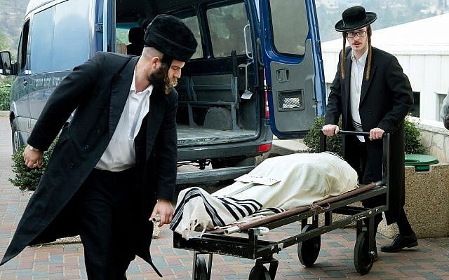 Illustrative: Members of a chevra kadisha, which prepares bodies for burial in accordance with Jewish customs, is seen prior to a burial. (Moshe Shai/Flash90) Illustrative: Members of a chevra kadisha, which prepares bodies for burial in accordance with Jewish customs, is seen prior to a burial. (Moshe Shai/Flash90)