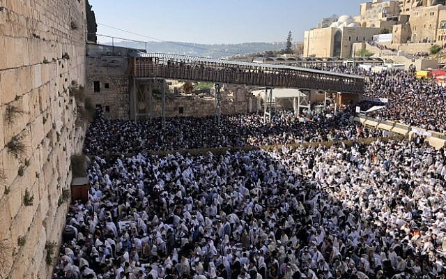 Jewish worshipers pray in front of the Western Wall in Jerusalem's Old City during the traditional priestly blessing on the Passover holiday, April 2, 2018 (Hadas Parush/Flash90) Jewish worshipers pray in front of the Western Wall in Jerusalem's Old City during the traditional priestly blessing on the Passover holiday, April 2, 2018 (Hadas Parush/Flash90)