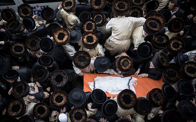 Ultra-Orthodox Jewish men attend the funeral of an infant boy who drowned to death in Ashdod, seen here during the burial ceremony at Kikar Hashabat, Jerusalem, on April 5, 2018. (Noam Revkin Fenton/Flash90) Ultra-Orthodox Jewish men attend the funeral of an infant boy who drowned to death in Ashdod, seen here during the burial ceremony at Kikar Hashabat, Jerusalem, on April 5, 2018. (Noam Revkin Fenton/Flash90)