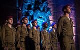 Israeli soldiers stand below a monument at a ceremony at the Yad Vashem Holocaust Memorial Museum in Jerusalem, as Israel marks Holocaust Remembrance Day, April 11, 2018 (Yonatan Sindel/Flash90)