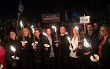 Leader of the Zionist Union party Avi Gabbay and Zionist Union MKs hold torches at a protest against attempts to enact laws that bypass the High Court of Justice and public criticism of the court's intervention in the legislative process, in Jerusalem, on  April 21, 2018. (Yonatan Sindel/Flash90)