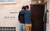 People seen outside the Bnei Zion pre-military academy in Tel Aviv, from which 10 youths were killed in a flash flood in the Judean Desert, on April 27, 2018. (Tomer Neuberg/ Flash90)