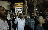 Hundreds of asylum seekers demonstrate in Levinsky Park in south Tel Aviv against the deportation deal with Uganda on April 8, 2018. (Melanie Lidman/Times of Israel)