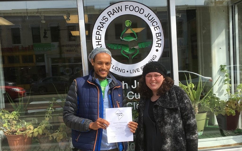 Maharat Ruth Friedman with the manager of Khepra’s Raw Food Juice Bar, a vegan restaurant she and Rabbi Shmuel Herzfeld recently certified kosher. (Courtesy of Friedman/via JTA) Maharat Ruth Friedman with the manager of Khepra’s Raw Food Juice Bar, a vegan restaurant she and Rabbi Shmuel Herzfeld recently certified kosher. (Courtesy of Friedman/via JTA)