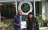 Maharat Ruth Friedman with the manager of Khepra’s Raw Food Juice Bar, a vegan restaurant she and Rabbi Shmuel Herzfeld recently certified kosher. (Courtesy of Friedman/via JTA)