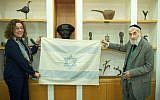 Ezra Gorodesky presents an Israeli Flag sewn by Rebecca Affachiner on May 14th, 1948 to Ben Gurion University President Prof. Rivka Carmi. (Dani Machlis/Ben Gurion University)