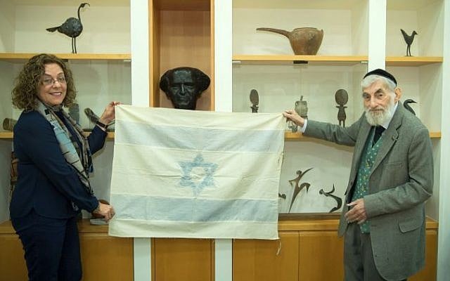 Ezra Gorodesky presents an Israeli Flag sewn by Rebecca Affachiner on May 14th, 1948 to Ben Gurion University President Prof. Rivka Carmi. (Dani Machlis/Ben Gurion University) Ezra Gorodesky presents an Israeli Flag sewn by Rebecca Affachiner on May 14th, 1948 to Ben Gurion University President Prof. Rivka Carmi. (Dani Machlis/Ben Gurion University)