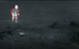 IDF footage showing Palestinian armed with what appears to be an assault rifle approaching Gaza security fence on April 5, 2018. (Screen capture)