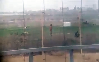 Footage filmed through a scope, publicized on April 9, 2018, that appears to show the moment before an Israeli sniper shoots a Palestinian who approached the Gaza security fence. (Screen capture)