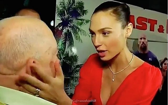 In a screenshot from a video shared by Gal Gadot to mark Holocaust Remembrance Day on April 12, 2018, the Israeli movie star touches the face of her late grandfather Abraham Weiss, a Holocaust survivor whose family was killed at Auschwitz. (Screen capture: Instagram) In a screenshot from a video shared by Gal Gadot to mark Holocaust Remembrance Day on April 12, 2018, the Israeli movie star touches the face of her late grandfather Abraham Weiss, a Holocaust survivor whose family was killed at Auschwitz. (Screen capture: Instagram)