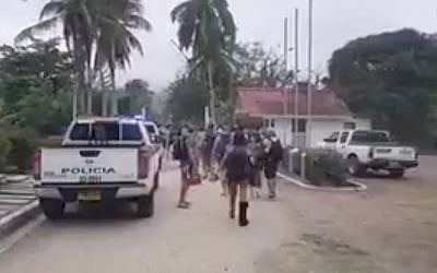 Partygoers leaving an event near the Colombia city of Santa Marta after it was raided by local authorities, who said large quantities of drugs were seized and that 90 percent of the participants were Israeli, on April 26, 2018. (Screen capture: Twitter)