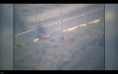 Still from footage released by the IDF on April 29, 2018 that shows Gazans attacking the border fence on April 27, 2018. (IDF screenshot)