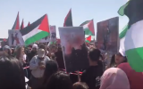 Arab Israelis wave Palestinian flags and participate in a march commemorating the "Nakba" (catastrophe) that accompanied Israel's creation, in Atlit, northern Israel, on April 19, 2018, Israel's 70th Independence Day. (Screen capture: Twitter)
