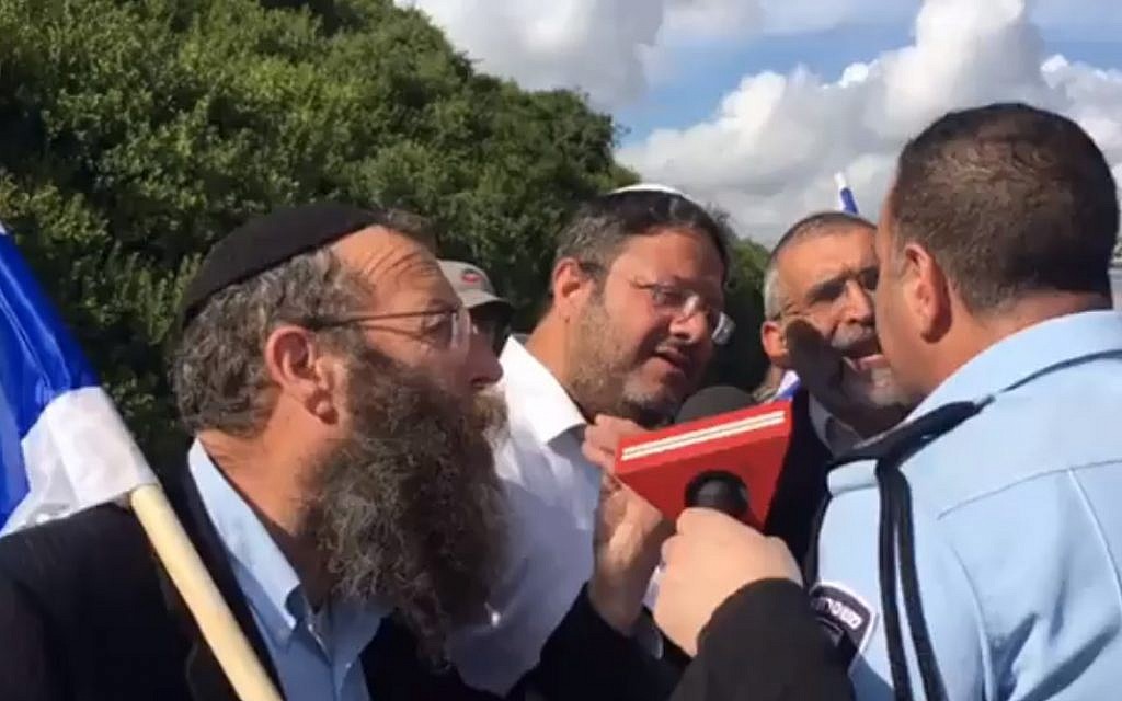 From L to R: Far-right activists Baruch Marzel, Itamar Ben Gvir and Michael Ben Ari confront a police officer who prevented them from attending an anti-mosque protest in Umm al-Fahm on April 10, 2017. (Channel 2 screenshot) From L to R: Far-right activists Baruch Marzel, Itamar Ben Gvir and Michael Ben Ari confront a police officer who prevented them from attending an anti-mosque protest in Umm al-Fahm on April 10, 2017. (Channel 2 screenshot)