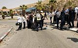 Israeli medics treat a man suspected of trying to stab someone at a West Bank gas station on April 8, 2018. (Magen David Adom)