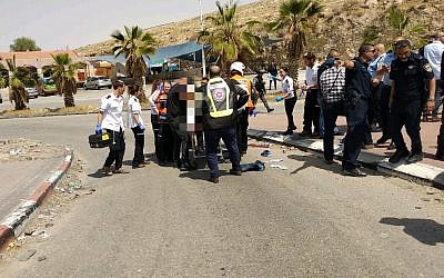 Israeli medics treat a man suspected of trying to stab someone at a West Bank gas station on April 8, 2018. (Magen David Adom)
