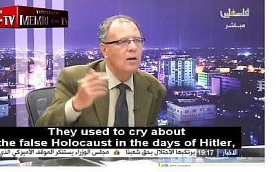 Screen capture from video of Palestinian political analyst and writer Hani Abu Zeid denying the Holocaust during an interview broadcast on Palestinian TV, April 10, 2018. (Facebook)
