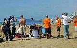 Paramedics try unsuccessfully to resuscitate a man who drowned on a Tel Aviv beach on April 19, 2018. (Magen David Adom)
