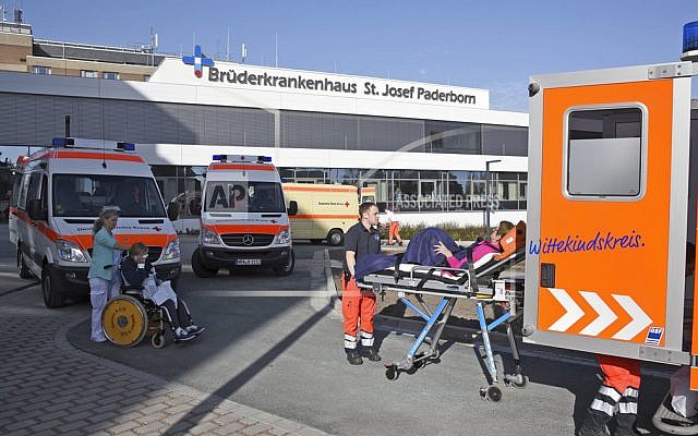 People being transported from the St. Josef hospital to other hospitals in Paderborn, Germany, as more than 26,000 people were asked to leave their homes in the western German town to allow specialists to remove a World War II-era bomb discovered during construction work. (Henning Kaiser/dpa via AP)