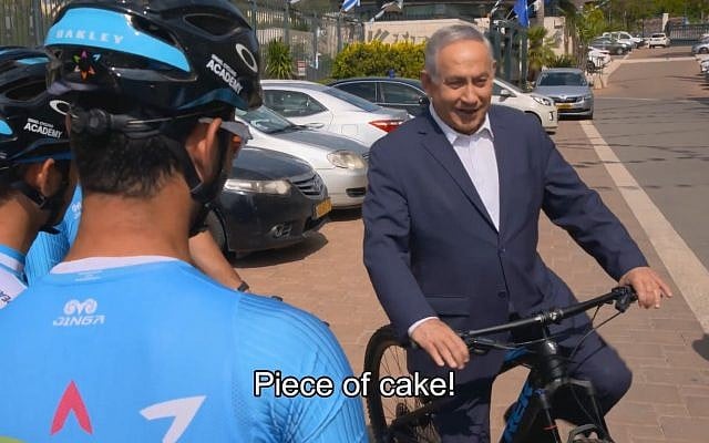 Prime Minister Benjamin Netanyahu hops on a bicycle in a video released on April 25, 2018, ahead of the Giro D’Italia cycle race to be held in Israel in May. (Screen capture: Twitter video) Prime Minister Benjamin Netanyahu hops on a bicycle in a video released on April 25, 2018, ahead of the Giro D’Italia cycle race to be held in Israel in May. (Screen capture: Twitter video)