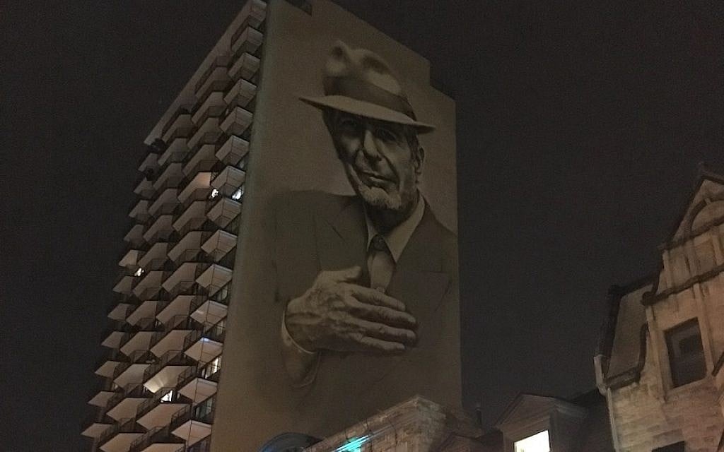 A painting of Leonard Cohen towers above Crescent Street in downtown Montreal. (Ben Harris/JTA) A painting of Leonard Cohen towers above Crescent Street in downtown Montreal. (Ben Harris/JTA)